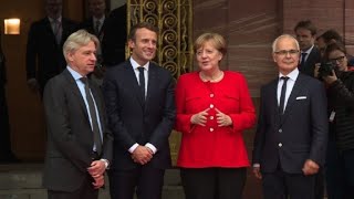 Merkel welcomes Macron at the Frankfurt book fair [upl. by Rives]