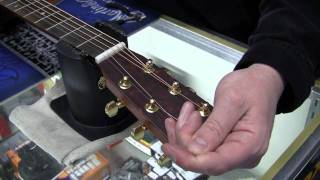 Restringing a steel string acoustic guitar [upl. by Hansen]