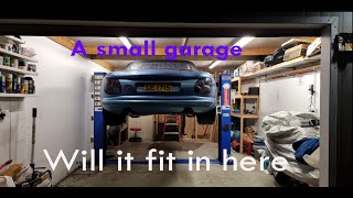 Installing a 2 post car lift in a small garage part1 [upl. by Ellennahs]