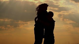 Silhouette of couple in love outdoors Sunset [upl. by Esorylime969]