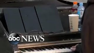 Man plays piano at UkrainianPolish border [upl. by Hilten]